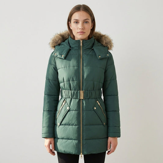 Green Charlotte quilted puffer jacket with faux-fur hood from Lumina Wear, showing the jacket's padded design and fur-lined hood.